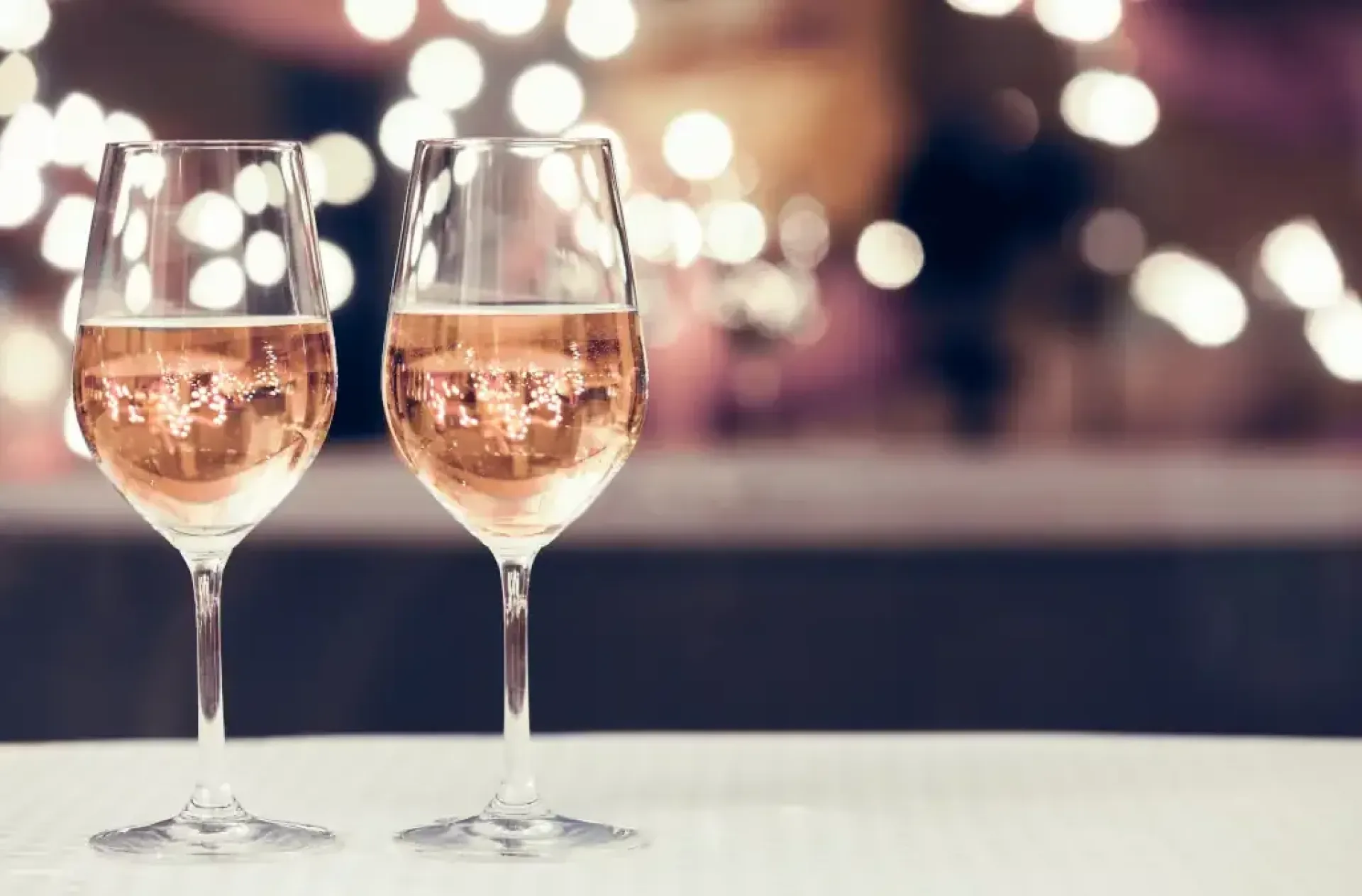Wine glasses in a restaurant setting.